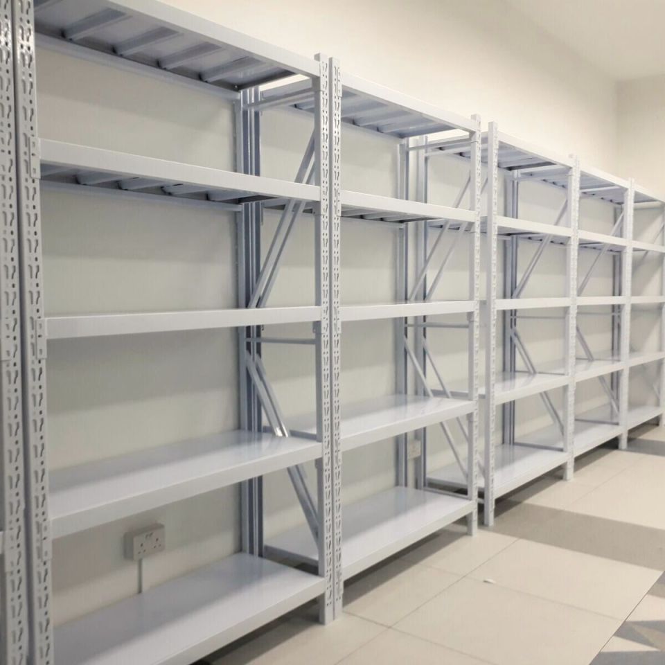 White steel rack shelving with open frames suited to a cold storage room